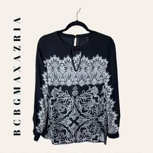 0755. BCBGMAXAZRIA LONG SLEEVE BLOUSE SIZE SMALL BLACK AND WHITE IN COLOR FLORAL